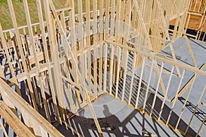 Aerial view the timber frame beam framework house stick built home under construction new build with wooden truss