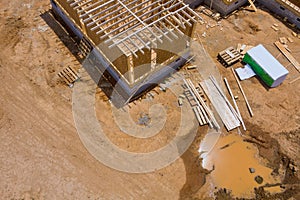 Aerial view the timber frame beam framework house stick built home under construction new build with wooden truss