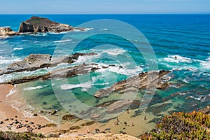 Aerial view to Alteirinhos beach with clear and turquoise sea, Zambujeira do Mar - Odemira PORTUGAL photo