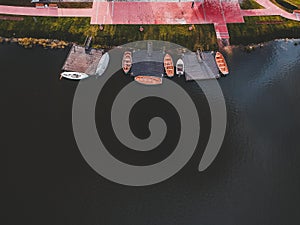 Aerial view to the boathouse. Rowing training boats moored to the pier. Russia, St. Petersburg.