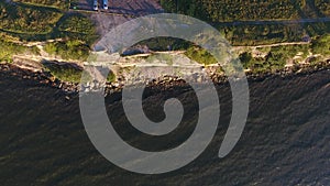 Aerial view to cliff, baltic sea and bicyclists