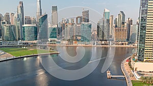 Aerial view to Dubai Business Bay and Downtown with the various skyscrapers and towers timelapse