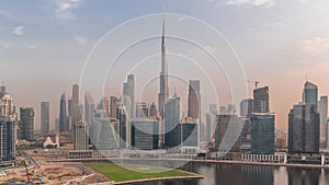 Aerial view to Dubai Business Bay and Downtown with the various skyscrapers and towers timelapse