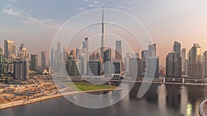 Aerial view to Dubai Business Bay and Downtown with the various skyscrapers and towers timelapse