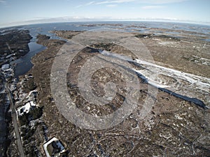 Aerial view to filling in the winter covered with snow.