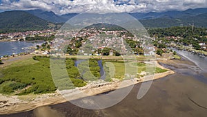 Aerial view to historic town Paraty with river mouth at low tide photo