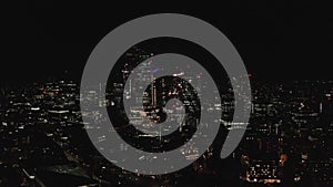 Aerial view to the illuminated skyline of London at night, UK.