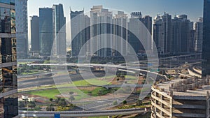 Aerial view to JLT and Dubai Marina with big highway intersection timelapse on sheikh zayed road and skyscrapers in the