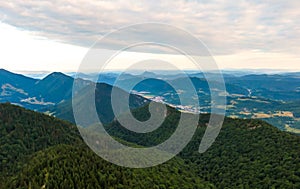 Aerial view to Mala Fatra mountains in Slovakia. Sunrise above mountain peaks and hills in far. Beautiful nature, vibrant colors.