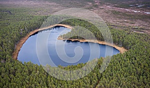 Aerial view to the natural heart-shaped forest lake on Parika nature reserve, Viljandi, Estonia