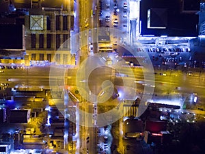 Aerial view to night city crossroads