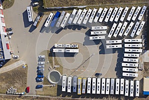 Aerial view to parking lot for autobus and trucks. Industrial background on transportation theme