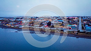 Aerial View to the Porvenir city under the Sunset Lights