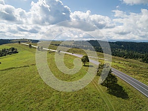 Aerial view to road with moutains captured from above