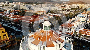 Aerial view to the rooftops of Playa de las americas buildings in Tenerife at sunset