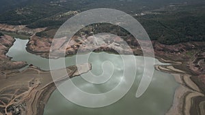 Aerial view to Sau reservoir blue green river Ter shoreline looking down mountain valley