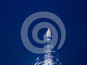 Aerial view to two Yachts in deep blue sea. Drone photography