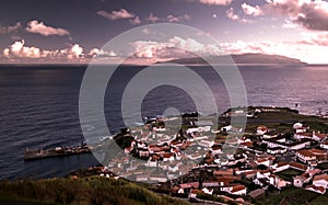 Aerial view to Vila do Corvo and Flores island at sunset, Corvo island, Azores, Portugal