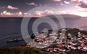 Aerial view to Vila do Corvo and Flores island at sunset, Corvo island, Azores, Portugal photo