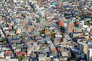 Aerial view of Tokyo apartments in cityscape background. Residential district in smart city in Asia. Buildings at noon. Japan