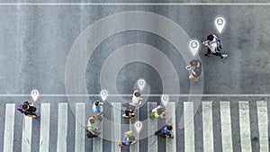 Aerial view and top view with blur man with smartphone walking converse with busy city crowd move to pedestrian crosswalk. concept