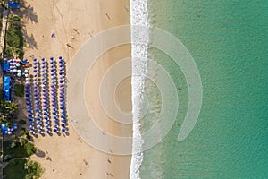 Aerial view Top down Flying above turquoise ocean and waves washing sandy beach in beautiful island Summer day