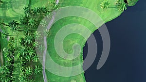 Aerial view top down of the green golf course in Thailand beautiful green grass and trees on a golf field with fairway and putting