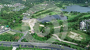 Aerial view top down of the green golf course in Thailand Beautiful green grass and trees on a golf field with fairway and putting