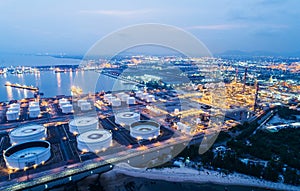 Aerial view or top view night light oil terminal is industrial facility for storage of oil and petrochemical.