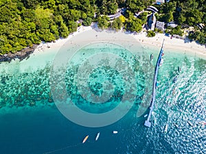 Aerial view or top view of tropical island beach with clear water at Banana beach, Coral Island, Koh Hey, Phuket