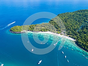 Aerial view or top view of tropical island beach with clear water at Banana beach, Coral Island, Koh Hey, Phuket