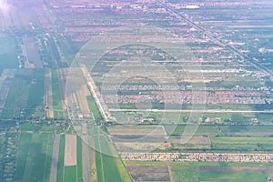 Aerial view topography city ground river with field and other from airplane in thailand