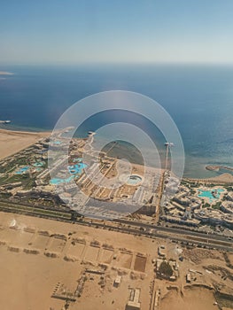 Aerial view of the touristic city of Hurghada from Egypt and the vibrant colors of the Red Sea.