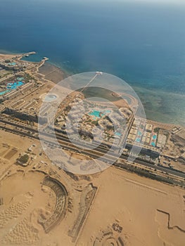 Aerial view of the touristic city of Hurghada from Egypt and the vibrant colors of the Red Sea.