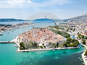 Aerial view of touristic old Trogir, historic town on a small island and harbour on the Adriatic coast in Split-Dalmatia, Croatia.