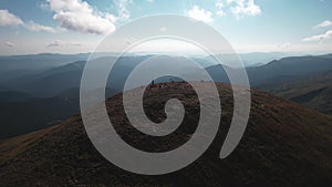 Aerial view of tourists climb to the top of the mountain Hoverla, Ukraine