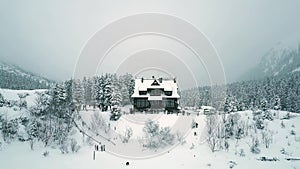 Aerial view of tourists and mountain chalet by the Morskie Oko or Sea Eye lake