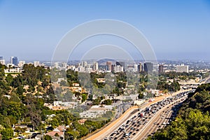 Aerial view towards the skyline of Westwood neighborhood; highway 405 with heavy traffic in the foreground; Los Angeles,