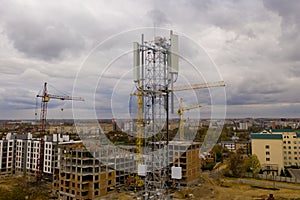 Aerial view of tower with 5G and 4G cellular network antenna