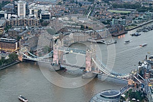 Aerial view of Tower Bridge and city skyline at night, London