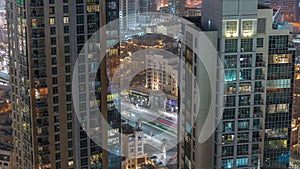 Aerial panoramic view of a big futuristic city night timelapse. Business bay and Downtown