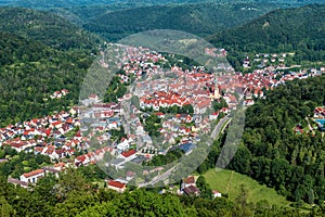Aerial view of town of Bad Urach, Germany. Panorama of small city in Swabian Alps, inhabited locality in Baden-Wurttemberg