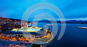 Aerial view of town center in Molde, Norway at night. View of the illuminated stadium photo