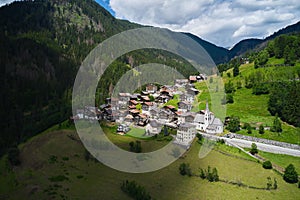 aerial view of the town of falcade alto trentino photo