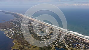 Aerial view of town, ocean and beach. 4k