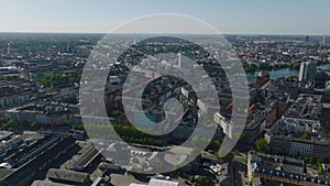Aerial view of townhouses in urban borough in metropolis. Tilt up reveal of flat landscape. Copenhagen, Denmark