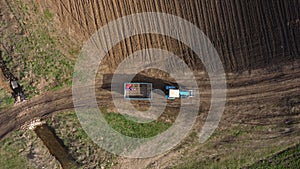 Aerial view of the tractor in the field, agricultural field work, sowing work in the field