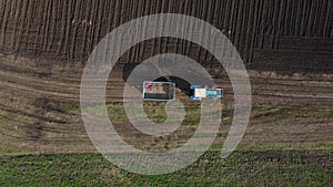 Aerial view of the tractor in the field, agricultural field work, sowing work in the field