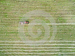 Aerial view of a tractor making hay cubes