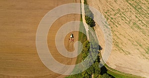 aerial view of tractor plowing field